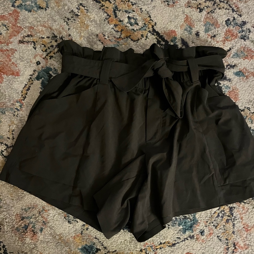 Athleta dark green shorts. Stretchy waist- can dress up and down. Size 4.